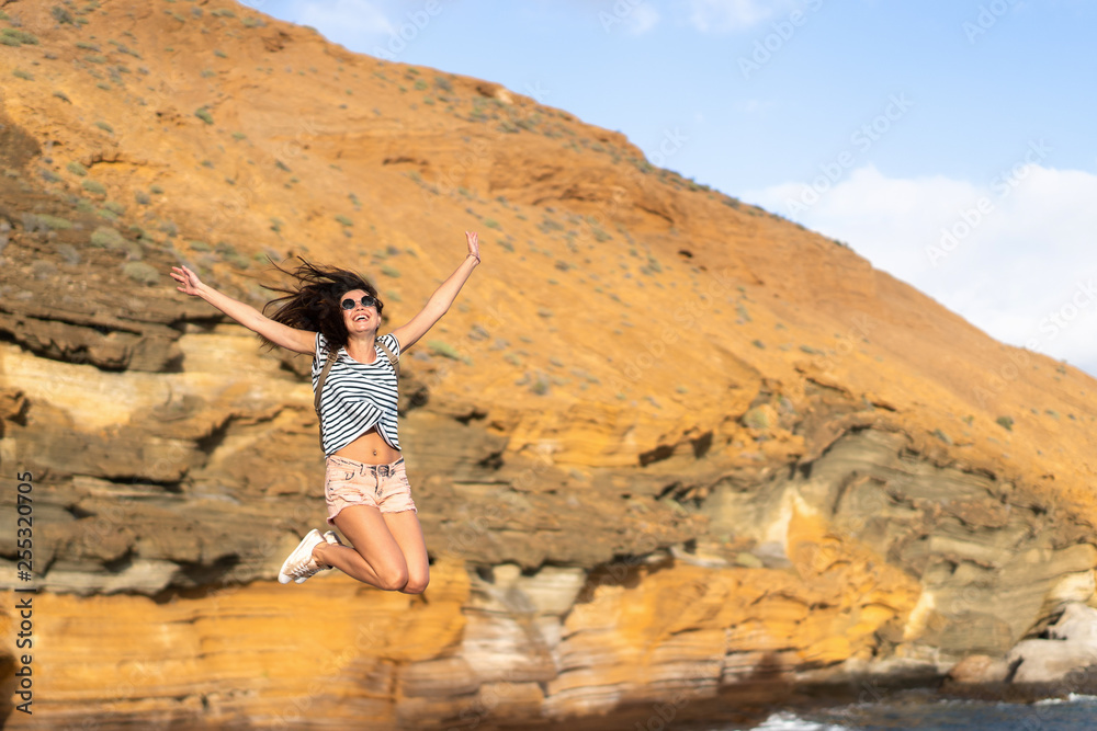 Pretty tourist brunette girl having fun outdoor near sea.