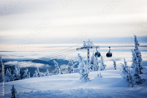 Snow-covered nature of Sheregesh with icy lift at the ski resort. © irinashamanaeva