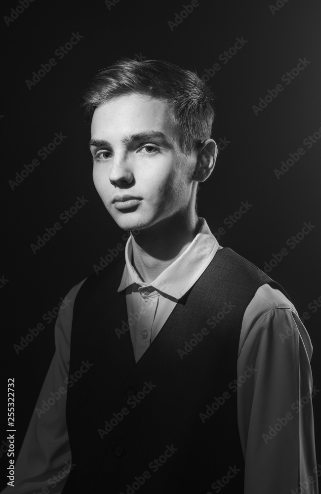 Portrait of a beautiful teenager in strict clothes with authentic appearance in vintage style Portrait of a beautiful teenager in strict clothes with authentic appearance in vintage style