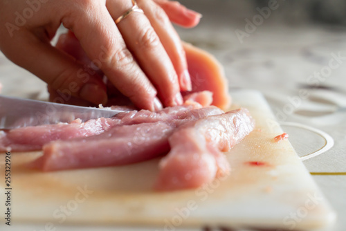 chopped meat food processing in the kitchen with knife