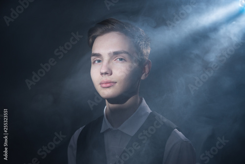 Portrait of a beautiful teenager in strict clothes with authentic appearance in vintage style