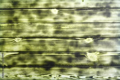 yellow striped and burned scratched modern wood door texture - pretty abstract photo background