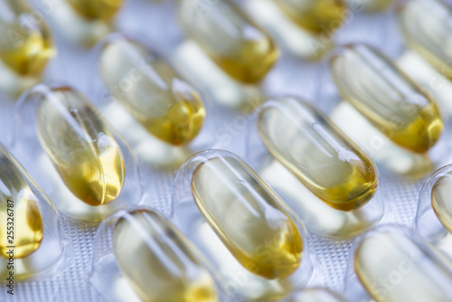 Yellow fish oil capsules in transparent foil or blister