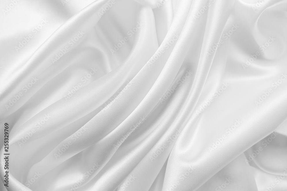Fototapeta premium Beautiful smooth elegant wavy white satin silk luxury cloth fabric texture, abstract background design. Copy space. Wedding, engagement concept.
