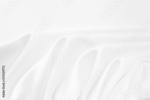 Beautiful smooth elegant wavy white satin silk luxury cloth fabric texture  abstract background design. Copy space. Wedding  engagement concept.