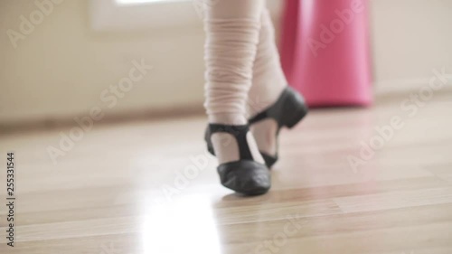  image of close-up feet of ballerina practicing