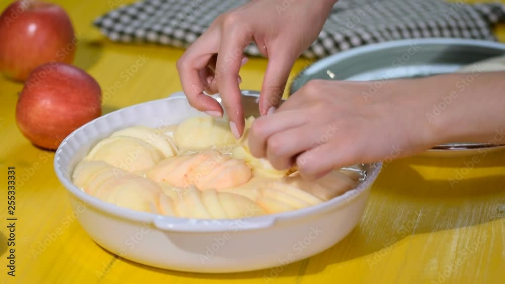 Womens hand making Apple cake. Close-up. Womens hand making Apple cake. Close-up.