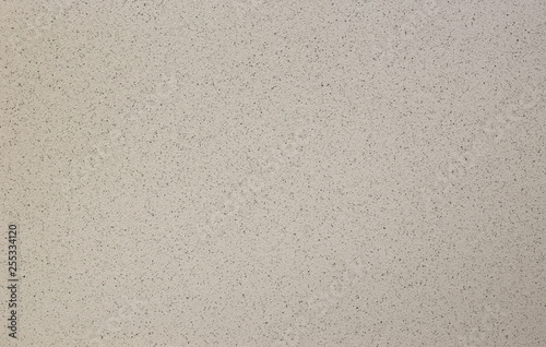 Photo of old gray cement wall with fractures.