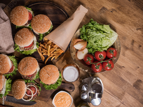Top view of various fast food on a wooden table