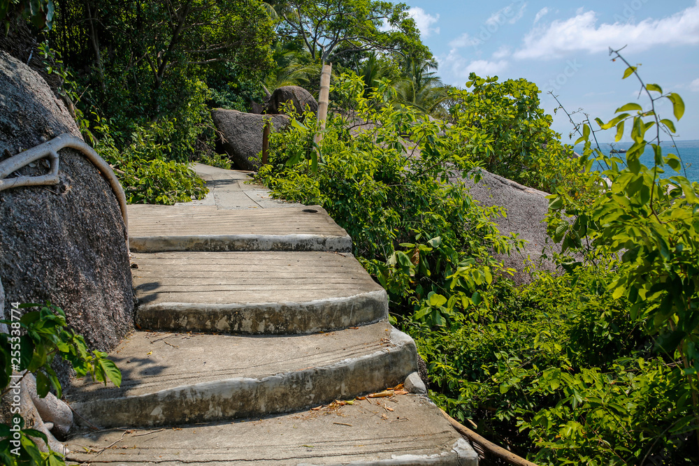 picturesque stone path along the rocky seashore on Koh Tao, Thailand