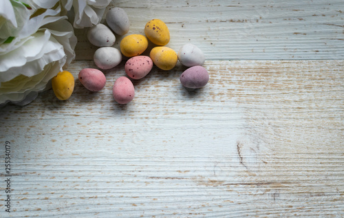 Chocolate Easter Eggs on a Wooden Background.