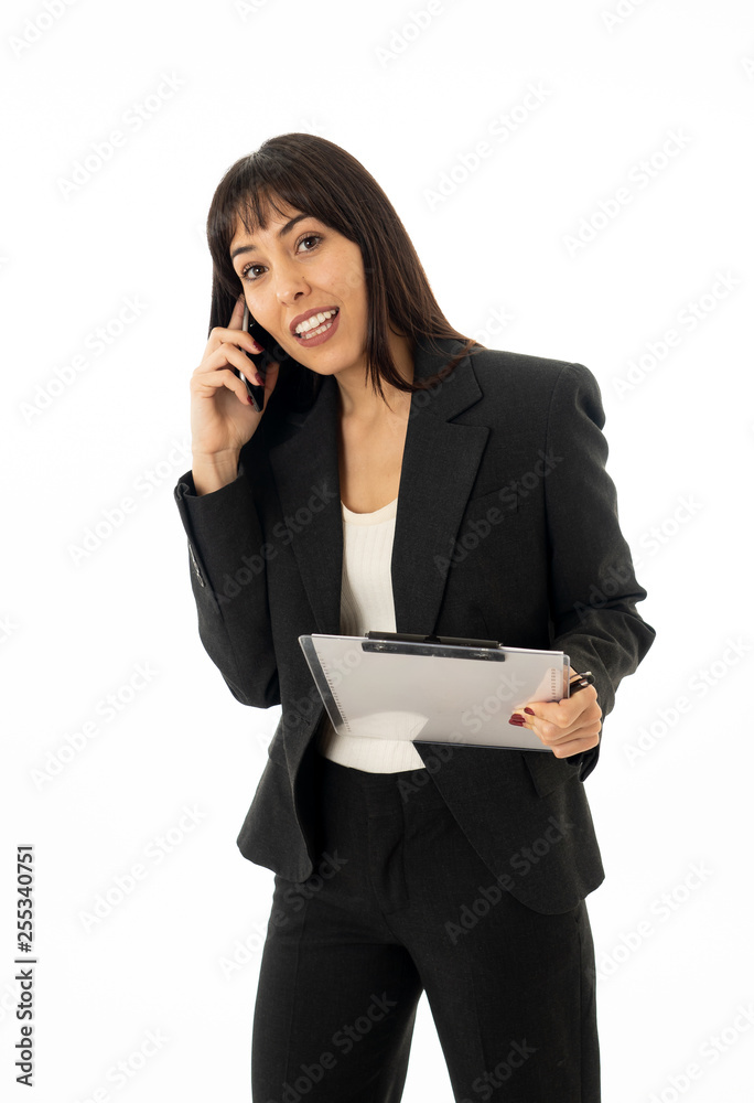 Successful young business woman talking on phone holding a folder. Isolated on white background. Successful young business woman talking on phone holding a folder. Isolated on white background.