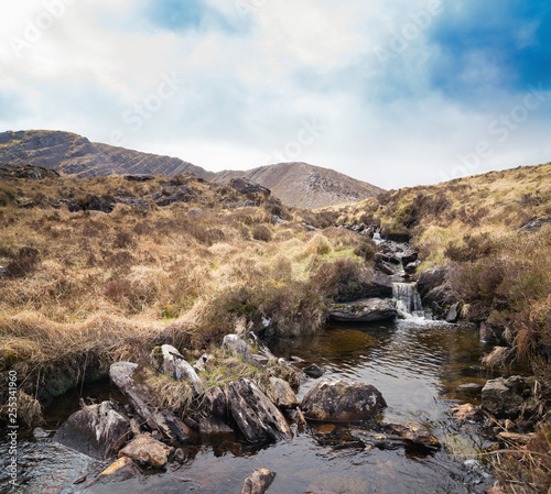 Spring  landscape with stony mountain stream in Kenmare photo