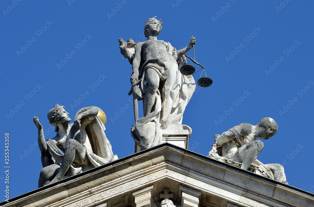 Justice, innocence and vice statues atop the Bavarian Ministry of Justice building, Munich