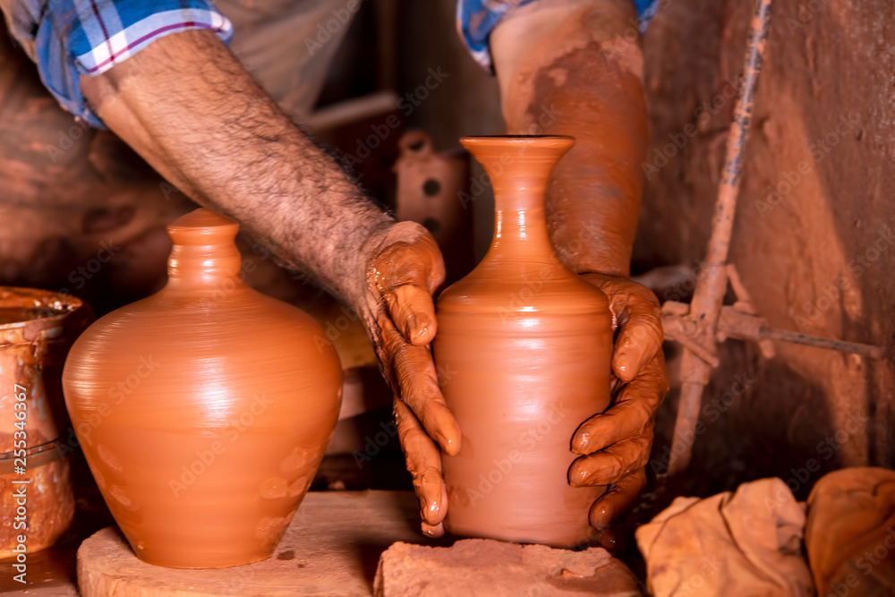 Professional potter making bowl in pottery workshop, studio. Professional potter making bowl in pottery workshop, studio.