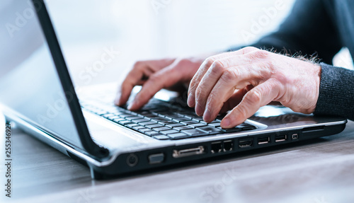 Male hands using a laptop