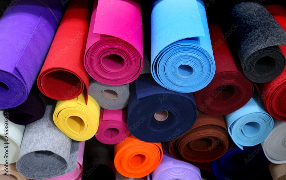 Shelf with a wide selection of colorful fabrics Shelf with a wide selection of colorful fabrics