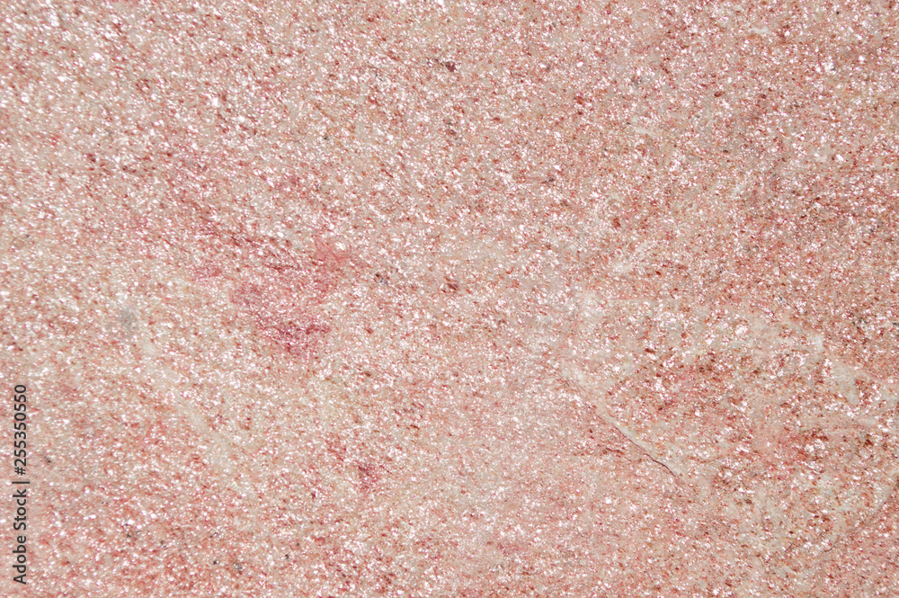 Fototapeta premium natural stone texture pink with sparkles, mother-of-pearl overflow background