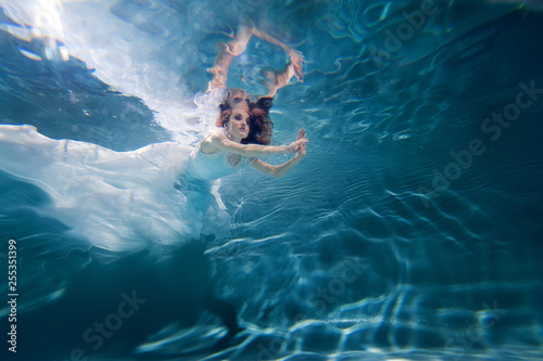 young woman underwater in different poses