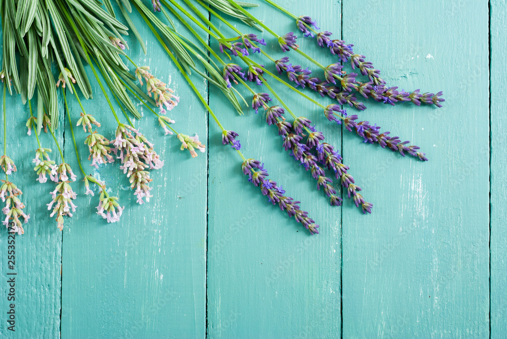 Fototapeta premium pink and purple lavender flowers on blue wood table background