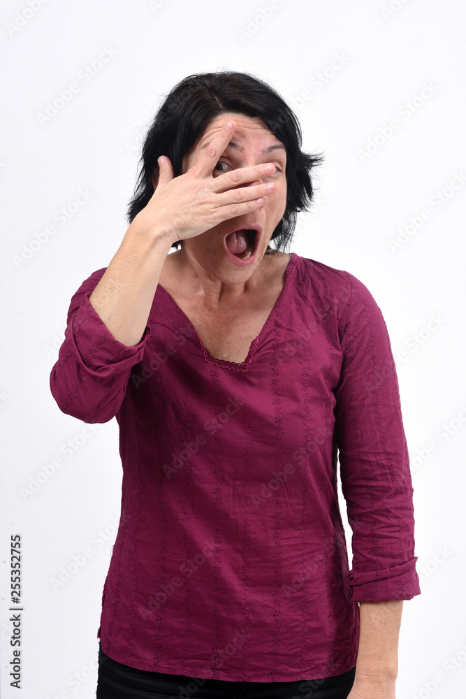 woman peeking with hand on face on white background woman peeking with hand on face on white background