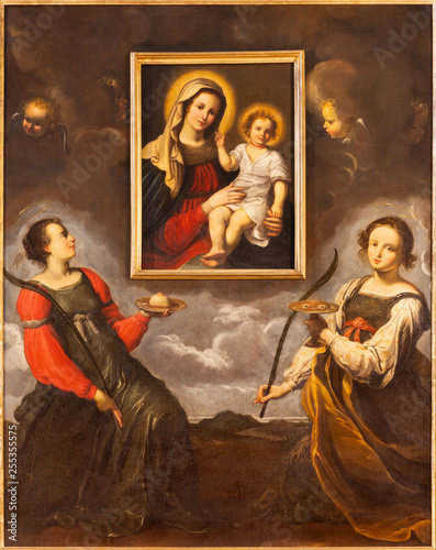PARMA, ITALY - APRIL 17, 2018: The saints Lucy and Agata adoring the image of Madonna in church Chiesa di Santa Lucia by master of Parma school from first half of 17. cent.