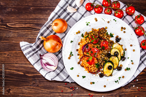 Wallpaper Mural Groats with lentils and vegetables on wooden table Torontodigital.ca