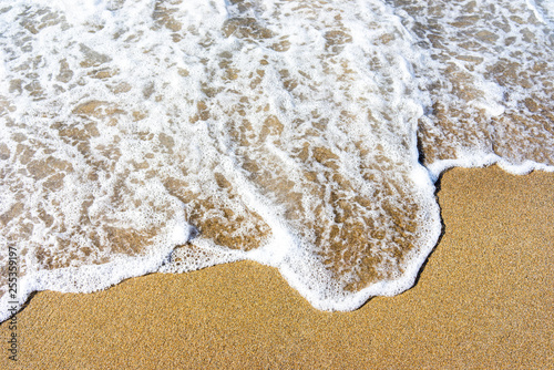 Fototapeta Naklejka Na Ścianę i Meble -  Soft wave of blue sea on sandy beach.