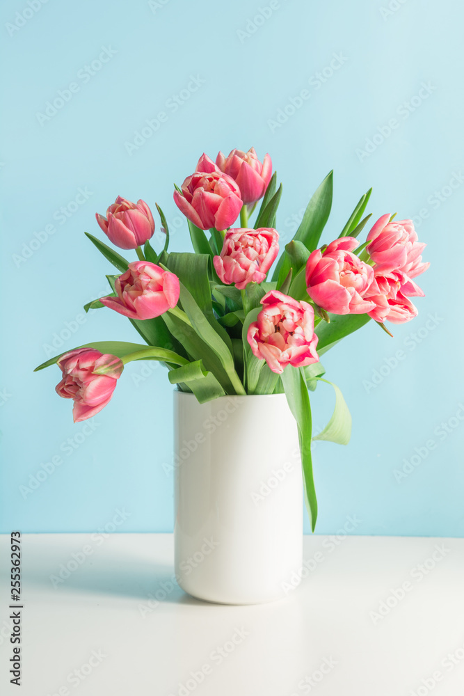 Bouquet of red tulip in vase on pastel millennial pink. Mothers day. Bouquet of red tulip in vase on pastel millennial pink. Mothers day.