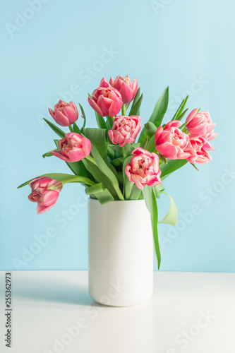 Wallpaper Mural Bouquet of red tulip in vase on pastel millennial pink. Mothers day. Torontodigital.ca