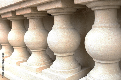 White bannister pillars made of stone. Stone columns