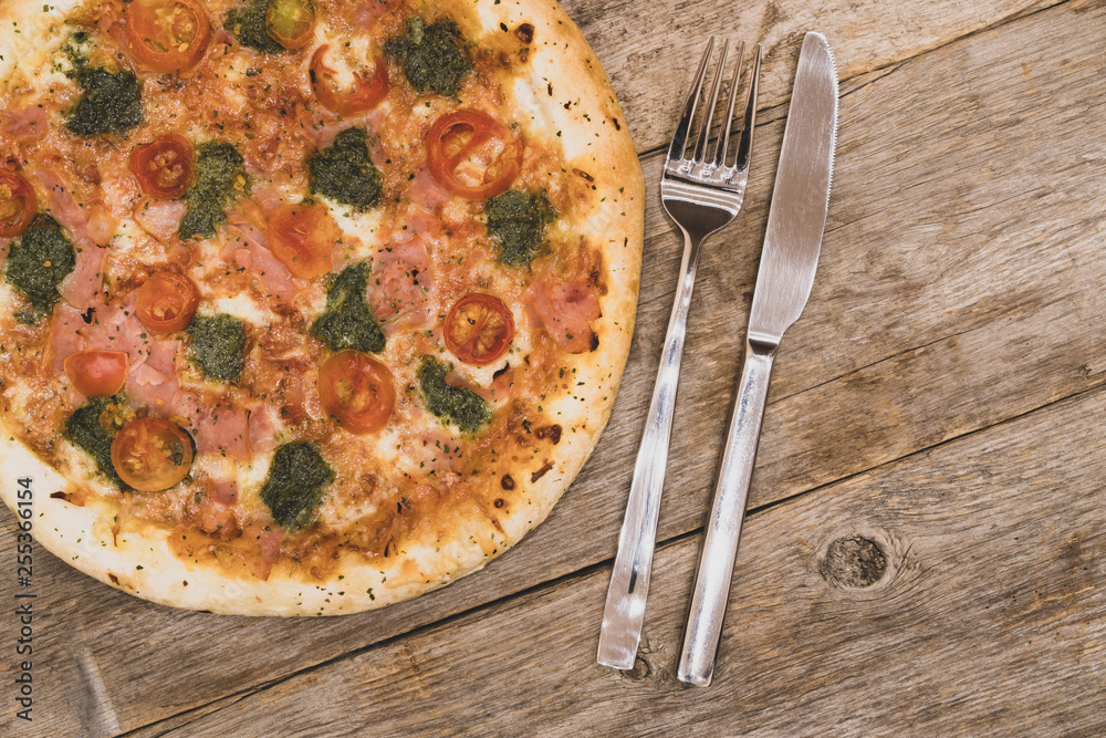 Delicious pizza with fork and knife Delicious pizza with fork and knife