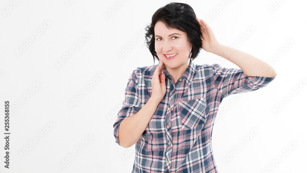 Beautiful middle aged brunette woman touches her neck and hair isolated on white