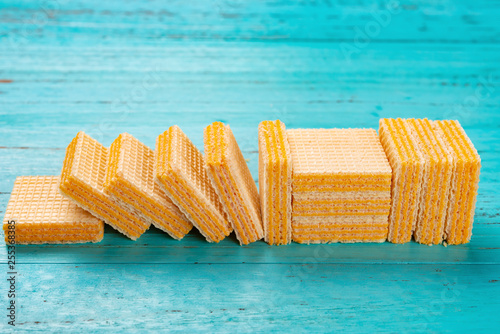 sdie view cheese wafer blocks on blue background photo