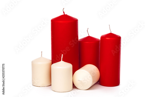 Red and white colored xmas candles isolated on white background