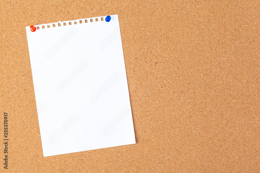 note paper pined on brown cork board background note paper pined on brown cork board background