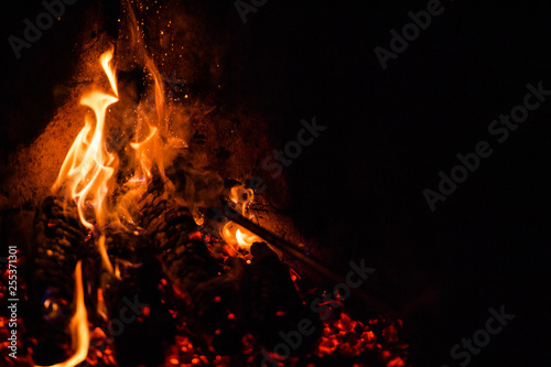 A glowing fire in the stone fireplace