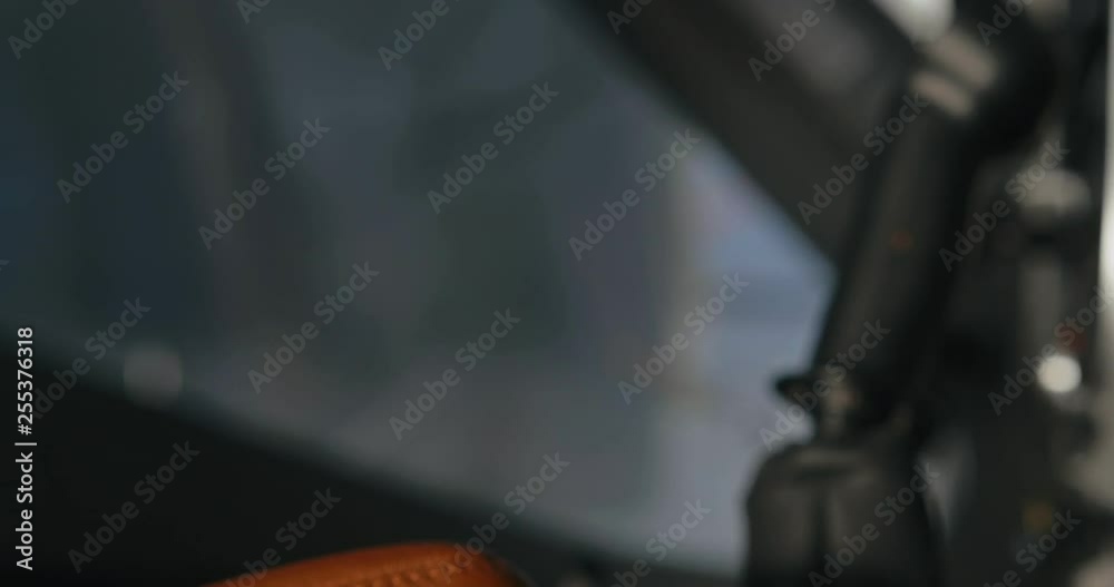 Close up of male hand opening and closing airplane cabin