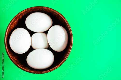 eggs in bowl on black background