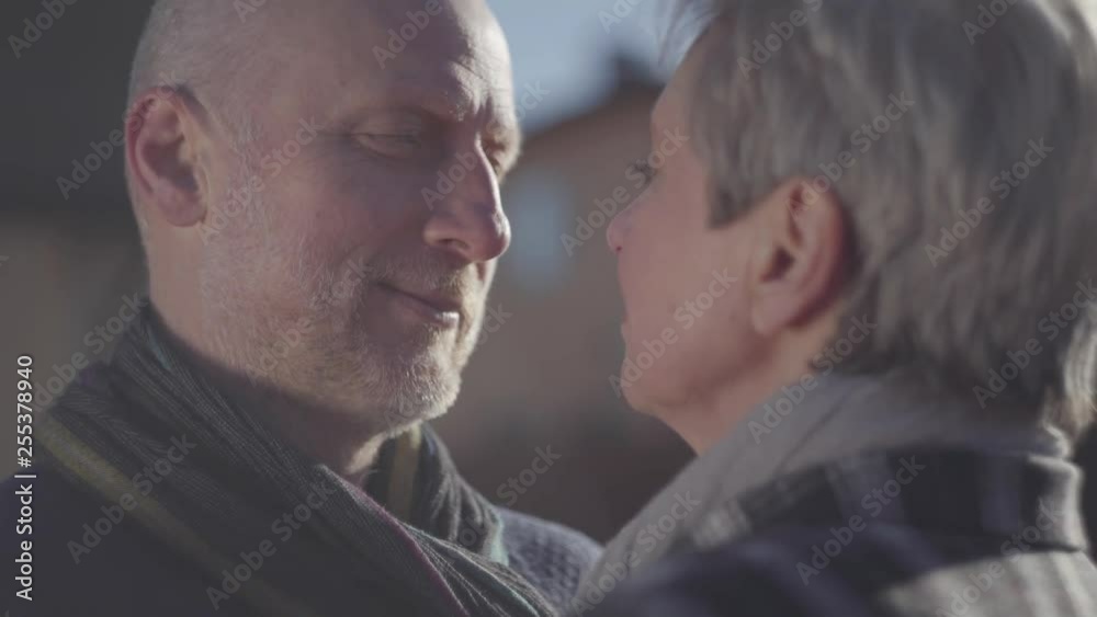 Portrait of senior man face close near face of senior woman. Senior couple talk to each other and look into eyes with love and passion. Family relationships. S-log, ungraded Portrait of senior man face close near face of senior woman. Senior couple talk to each other and look into eyes with love and passion. Family relationships. S-log, ungraded