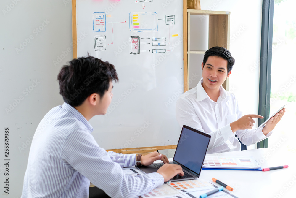 Young man designers planning work together on website ux app development.