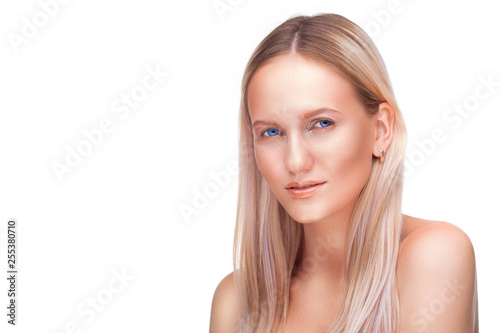 Beautiful blonde woman face studio on white. high key portrait