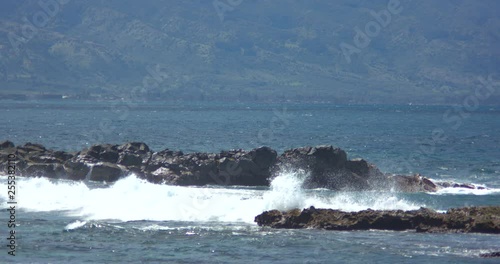 Waves Crashing over Three Tables on the North Shore of Oahu
