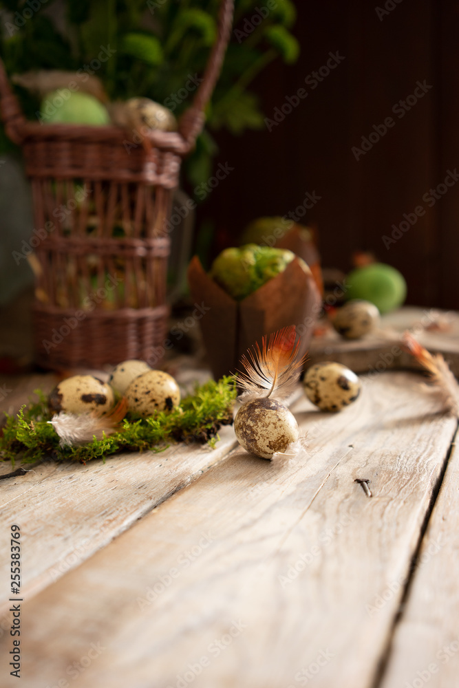 small easter eggs on a wooden background with plants