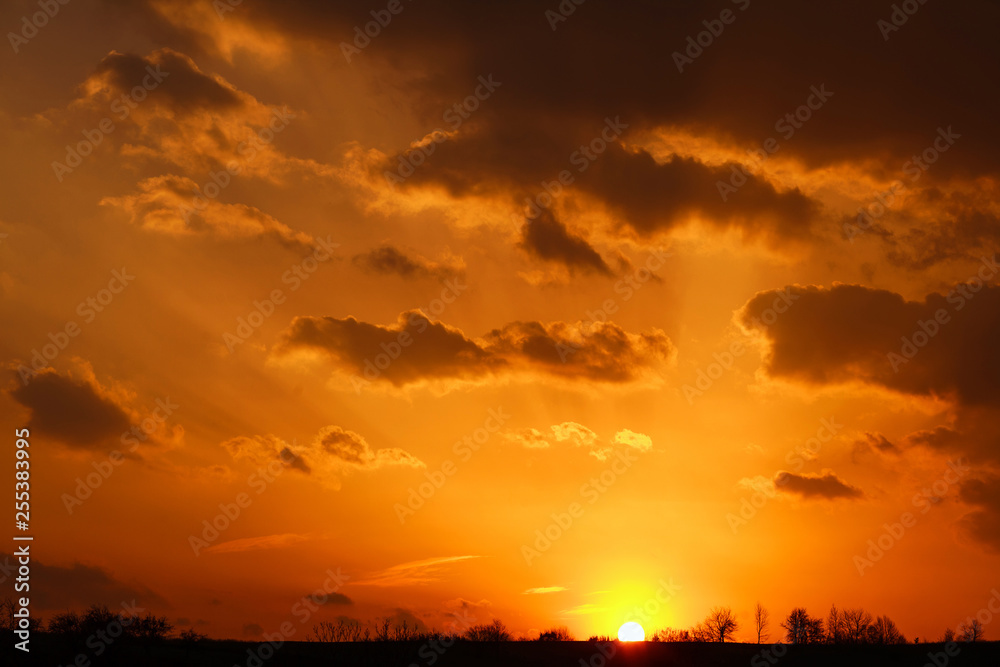 Landscape of colorful dramatic sky clouds in rays of sunset light, beautiful nature background Landscape of colorful dramatic sky clouds in rays of sunset light, beautiful nature background