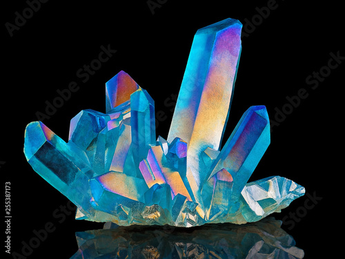 Amazing colorful Quartz Rainbow Flame Blue Aqua Aura crystal cluster closeup macro isolated on black background