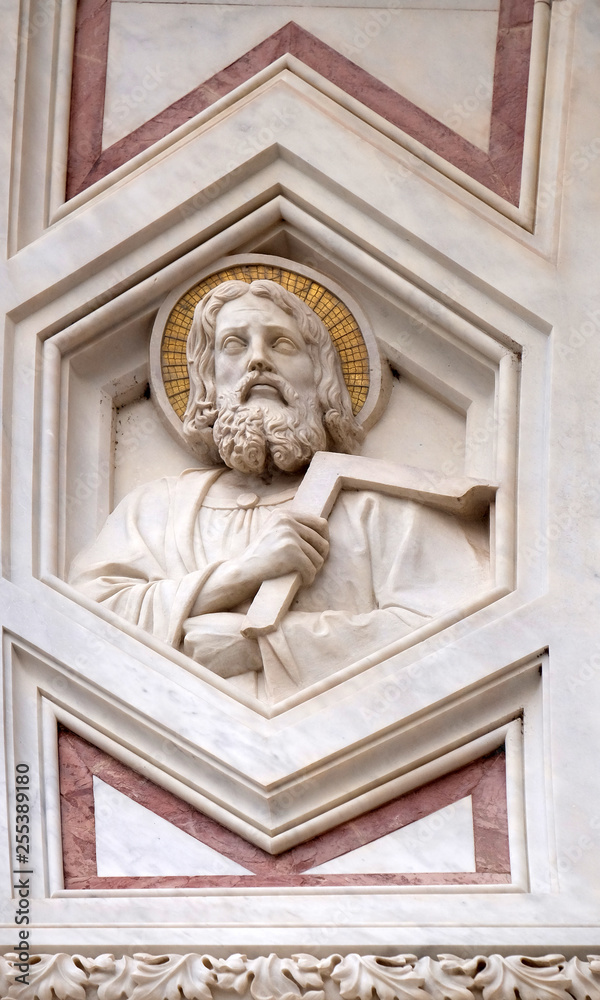 Saint Thomas the Apostle, relief on the facade of Basilica of Santa Croce (Basilica of the Holy Cross) - famous Franciscan church in Florence, Italy