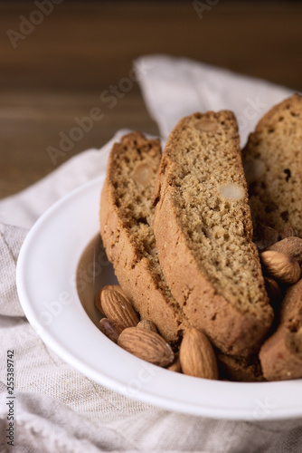 Tasty Traditional Italian Sweets Biscotti or Cantucci on White Plate Wooden Background Italian Biscotti for Coffee or Wine Italian Snack