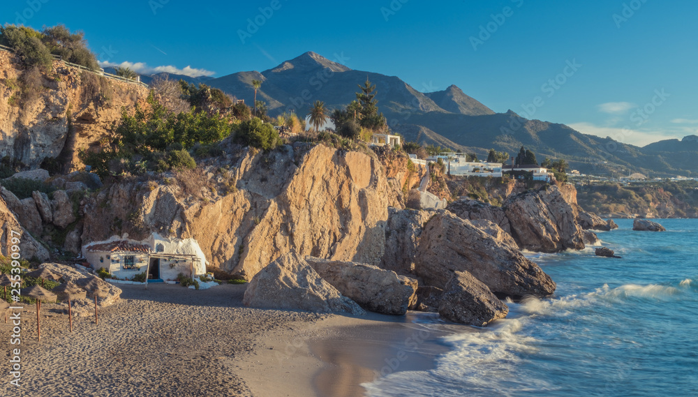 Nerja, Malaga, Andalusi, Spain - January 27, 2019: Start a new day at the small beach in the town of Nerja, southern Spain