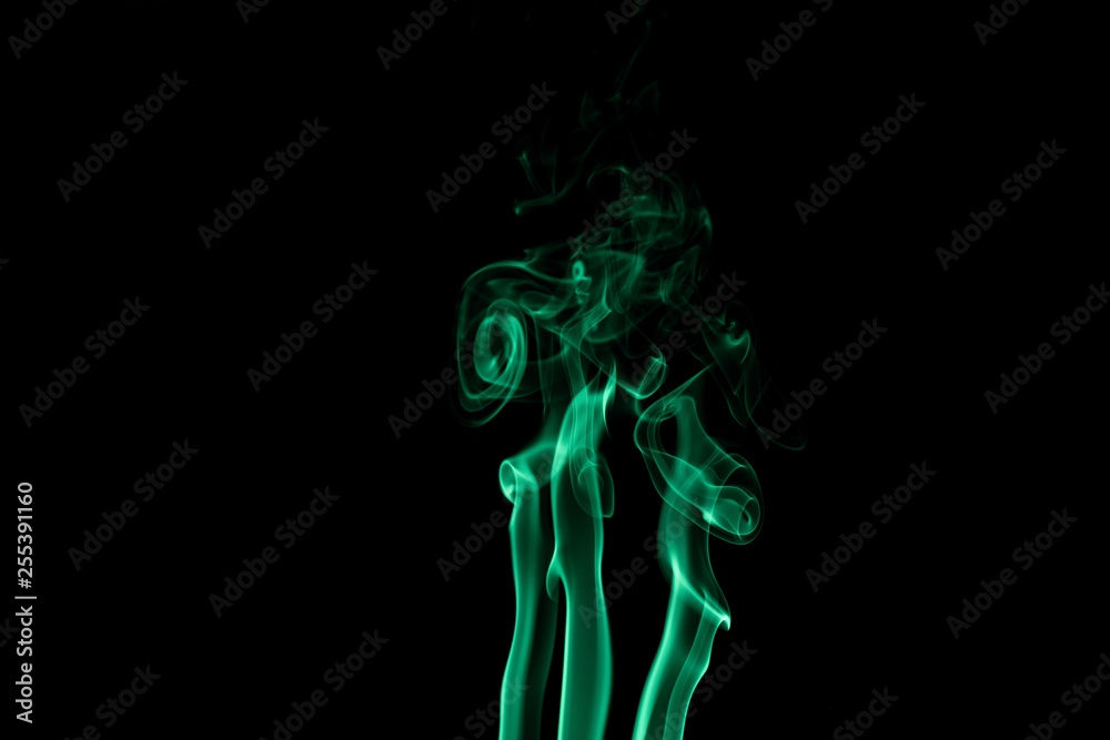 Abstract backgrounds and wallpapers. Colorful smoke on black background..